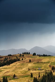 Spring rain in mountains. Thunder and clouds.