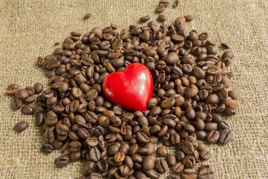 symbol heart on background Brown roasted coffee beans