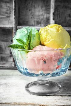 fruit ice cream scattered on background of blueberries