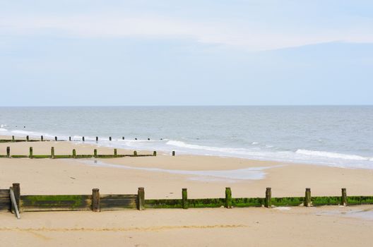 Sandy beach with breakwaters