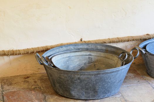 cast iron washing tubs on floor