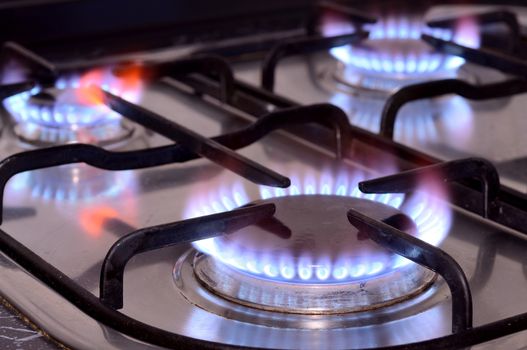 Closeup shot of fire from gas kitchen stove.