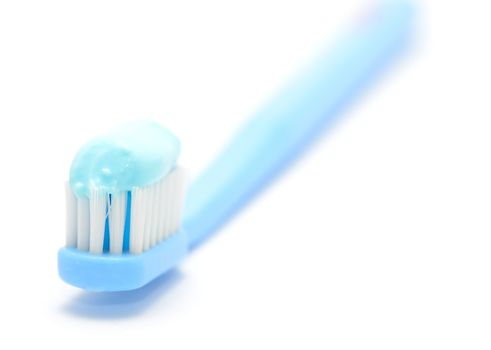 Macro shot of toothbrush on the white background.