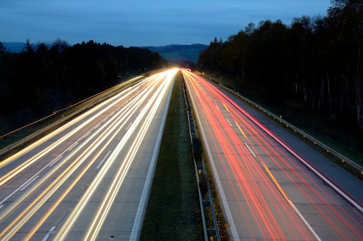 Long exposure shot of highway at night.