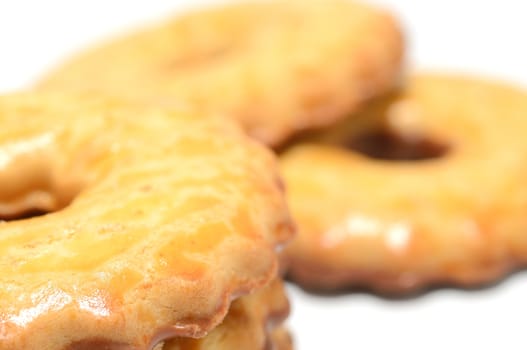 Macro shot of milk cookies with chocolate on a white background.