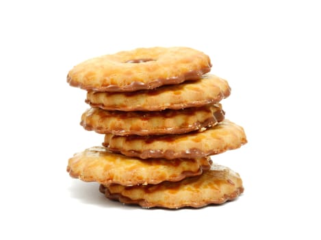 Stack of milk cookies with chocolate on a white background.