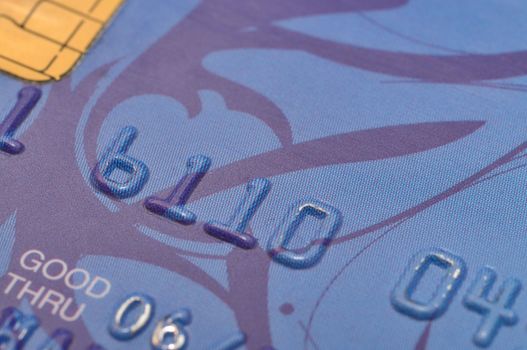 Macro shot of old blue bank card.