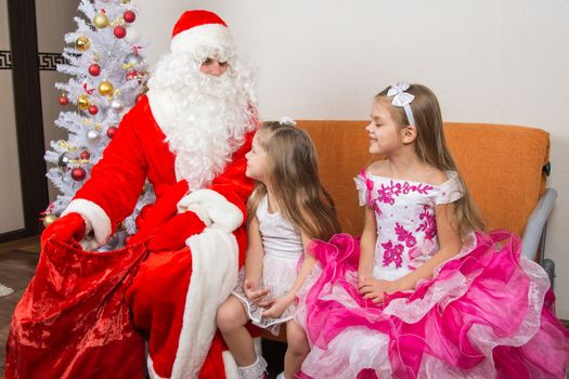 The girls looked at the bag drop frost grandfather waiting for gifts