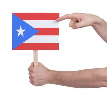 Hand holding small card, isolated on white - Flag of Puerto Rico