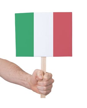 Hand holding small card, isolated on white - Flag of Italy