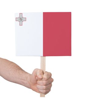 Hand holding small card, isolated on white - Flag of Malta