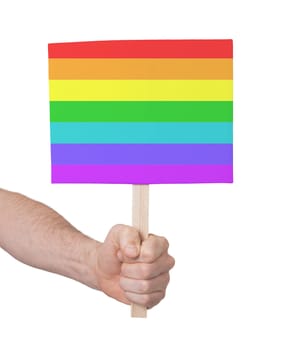 Hand holding small card, isolated on white - Flag of Rainbow flag