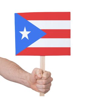 Hand holding small card, isolated on white - Flag of Puerto Rico