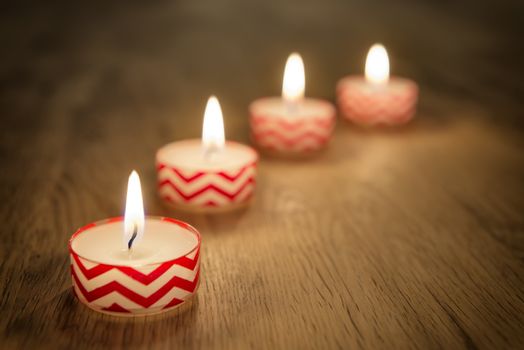 Romantic image of candles on a wooden table