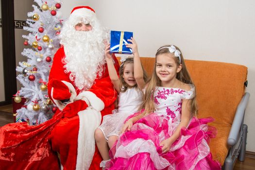 Santa Claus presented the first gift girls