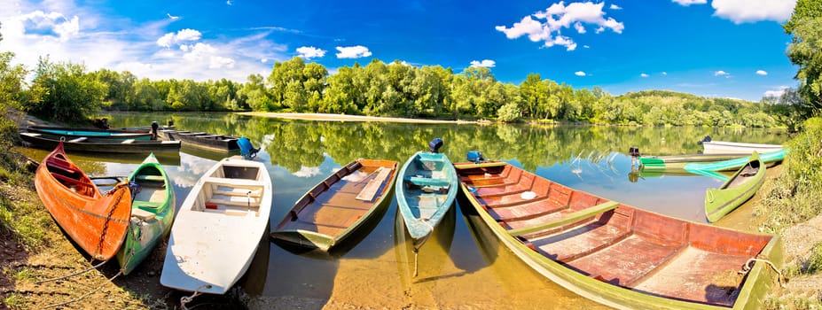 Colorful boats on Mura Drava mouth pannoramic view, Podravina, Croatia