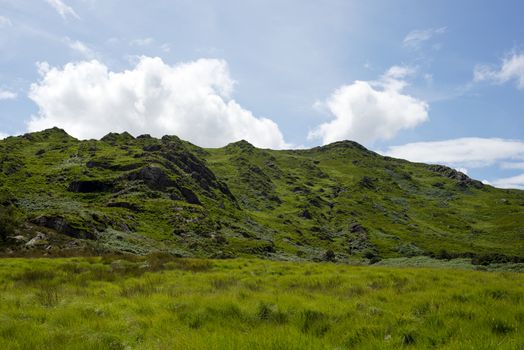 view from a beautiful hiking route the kerry way in ireland of rocky green mountains