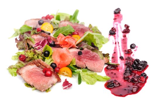 Grilled veal, pork or beef meat with cranberry and blackcurrant sauce, pink pickled ginger and fresh vegetable salad