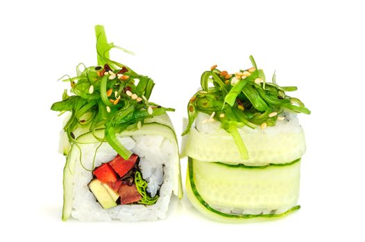 Uramaki maki sushi, two rolls isolated on white. Philadelphia cheese, cucumber, tuna, bell pepper, avocado and sesame. Chuka seaweed with sesame on top.