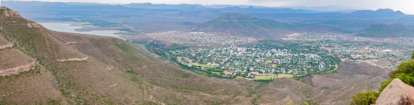 A panoramic view of Graaff Reinet as seen from the road to the Valley of Desolation viewpoint. The town lies in a horseshoe bend of the Sundays River