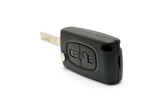 Remote black key car placed on a white background.