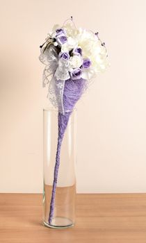 Interior decoration, decorative purple flower in the glass.