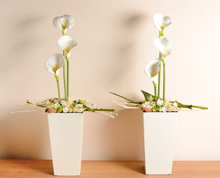 Interior decoration, decorative white calla in the white flowerpot.