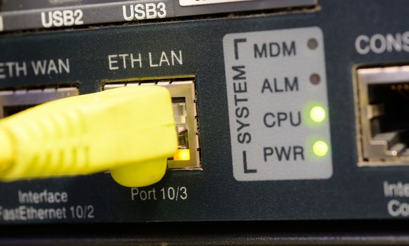 Yellow patch cord plugged to the ethernet port.