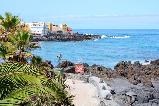 View of the Puerto de la Cruz coast and promenade. Punta Brava in background. Tenerife, Spain.