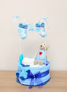 Blue newborn present, decoration on the table.