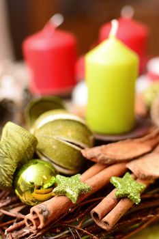 Christmas decoration with red and green candles closeup.