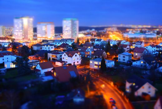 Prague city with big prefabs and houses at twilight with tilt-shift effect.