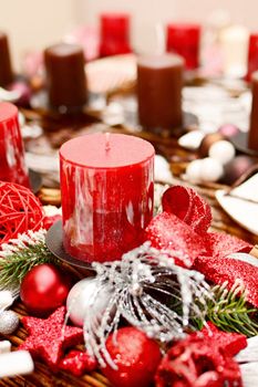 Interior Christmas home decoration on the table with red candle.