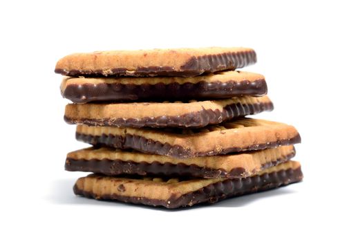 Stack of butter cookies with dark chocolate topping on a white background.