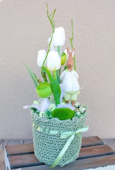 Easter floral home decoration on the table. Homemade arrangement.