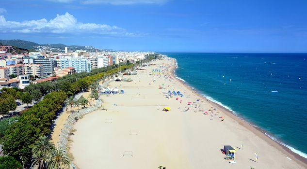 Beach of the seaside town Calella, part of the Costa Brava destination in Catalonia, Spain.