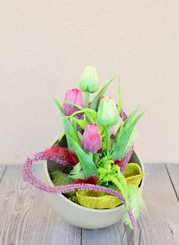 Easter floral home decoration on the table. Homemade arrangement.