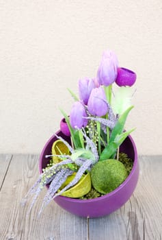 Easter floral home decoration on the table. Homemade arrangement.