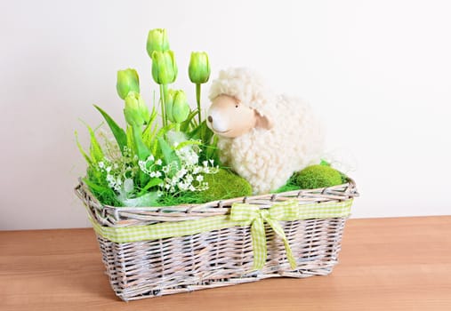 Easter floral home decoration on the table. Homemade arrangement.