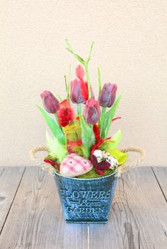 Easter floral home decoration on the table. Homemade arrangement.