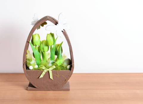 Easter floral home decoration on the table. Homemade arrangement.