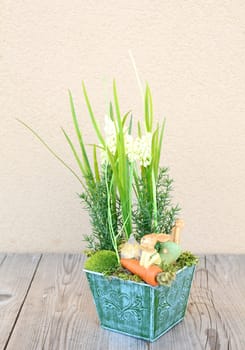 Easter floral home decoration on the table. Homemade arrangement.