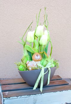 Easter floral home decoration on the table. Homemade arrangement.