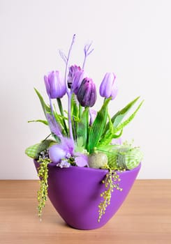 Easter floral home decoration on the table. Homemade arrangement.