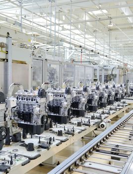 Production line for manufactoring of the engines in the car factory.