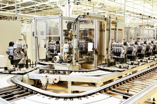 Production line for manufactoring of the engines in the car factory.
