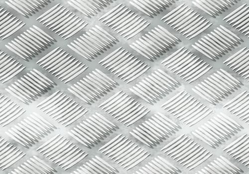 The ribbed silver metal plate surface texture.