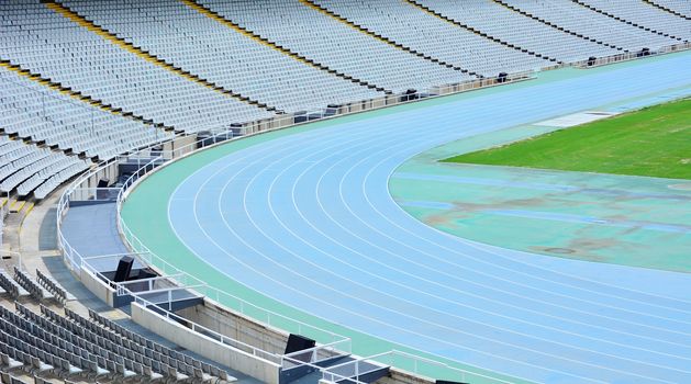 Stadium with running track and seats.