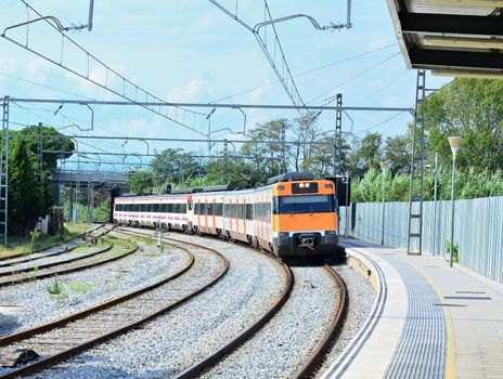 The train is arriving to the train station in Blanes, Spain.