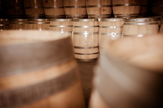 Wine barrels stacked in cellar, Bordeaux Vineyard, France